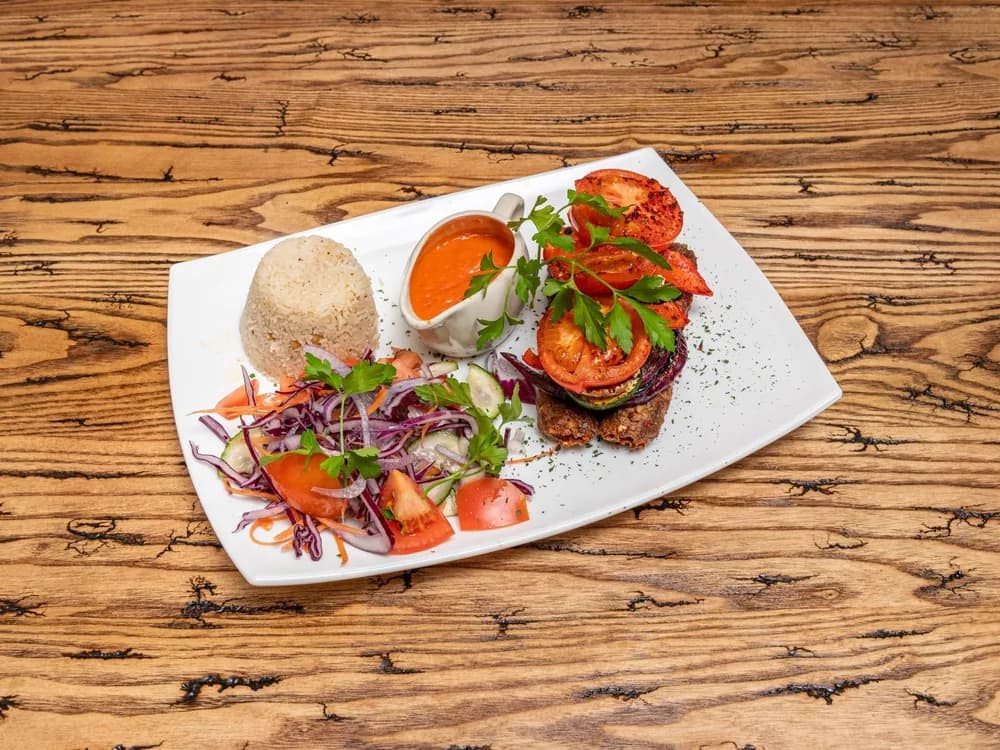 Grilled meat platter with rice and salad